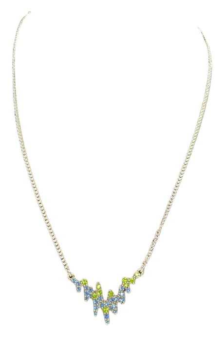 Northern Lights A&C Oslo Norway necklace featuring a zigzag pendant with blue and green crystals, inspired by Norwegian jewelry, displayed on a white background.
