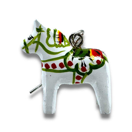 A small, white Dala Horse-shaped charm with colorful painted details and a metal loop on top, encapsulating the intricate artistry of Grannas Olsson, reminiscent of the design seen in the 2cm Dala Earrings.