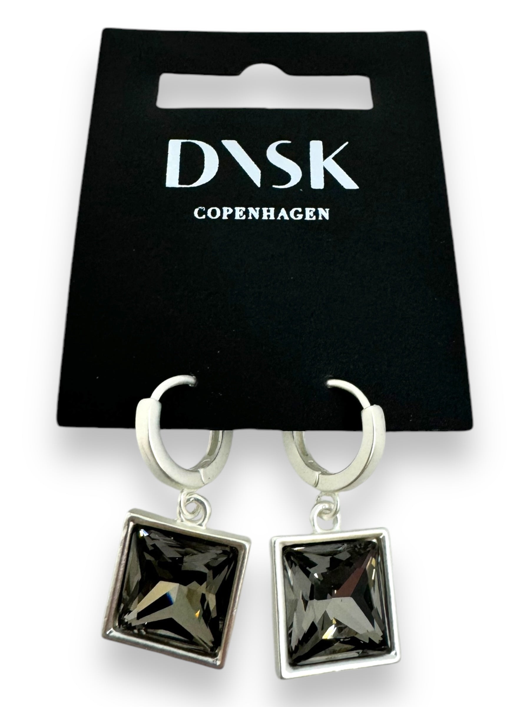 Audrey Black Diamond Silver Plated earrings by DASK Copenhagen feature a minimalistic Nordic design and come elegantly presented on a sleek black backing card.