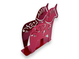 The Metal Swedish Dala Horse Napkin or Letter Holder is a red metal napkin holder with two stylized horses and kurbits-inspired cut-out patterns, bringing Scandinavian style to your table. Shown against a white background.