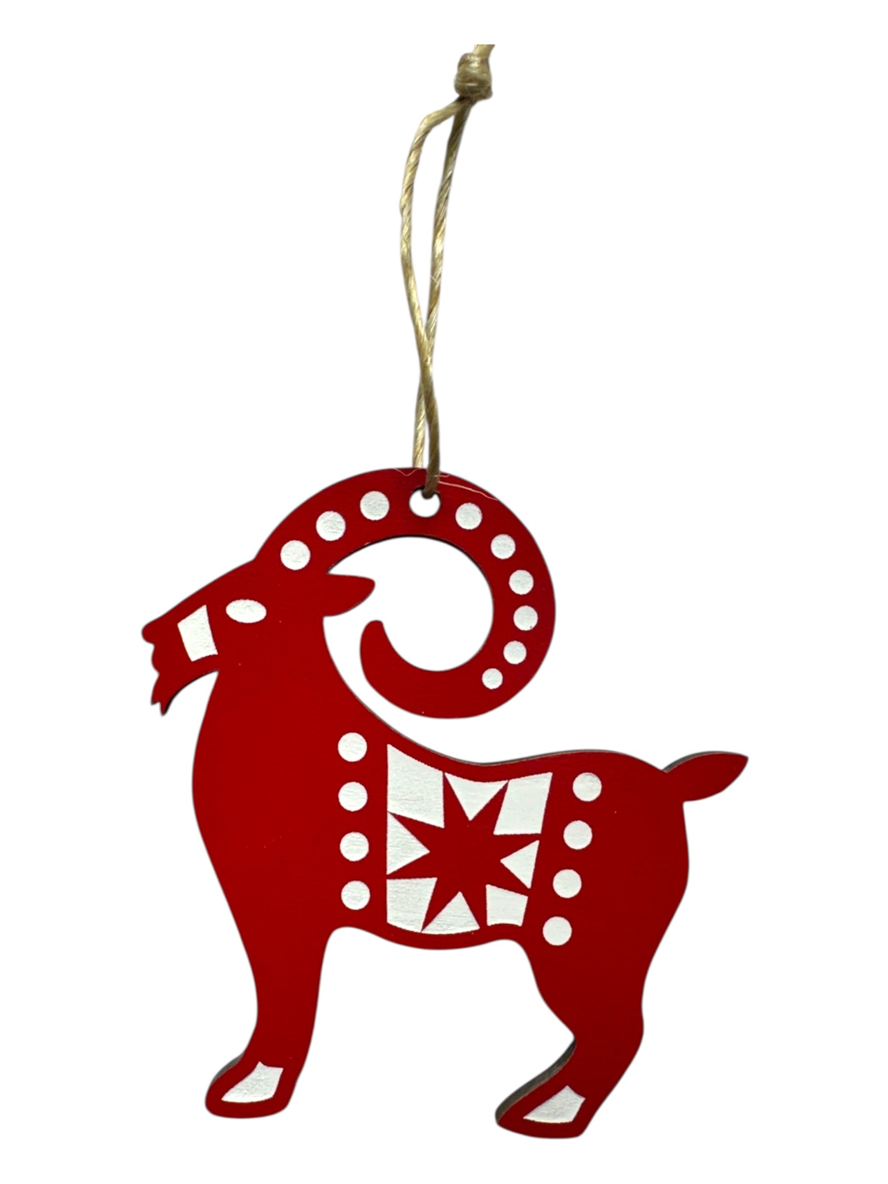The Ornament: Jule Goat Red & White "Julbok" is a laser-cut wood decoration in red and white, featuring a festive goat design and a hanging loop—ideal as a Swedish Christmas ornament.
