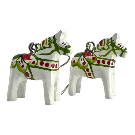Earrings: Dala Horse White Earrings – Handcrafted Swedish Folk Art (2cm/0.75 high), featuring small white wooden horses with green and red patterns and a metal loop, perfect for adding Swedish charm to your style.