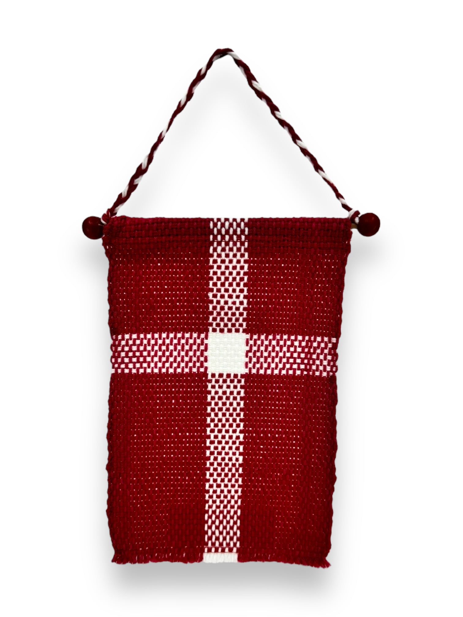 The product, named "Flag: Small Danish Flag on Hanger (6.5\"x4\")," consists of a woven pouch in red and white featuring a cross pattern similar to the Danish flag, complete with a twisted cotton cord handle adorned with decorative knots at each end.