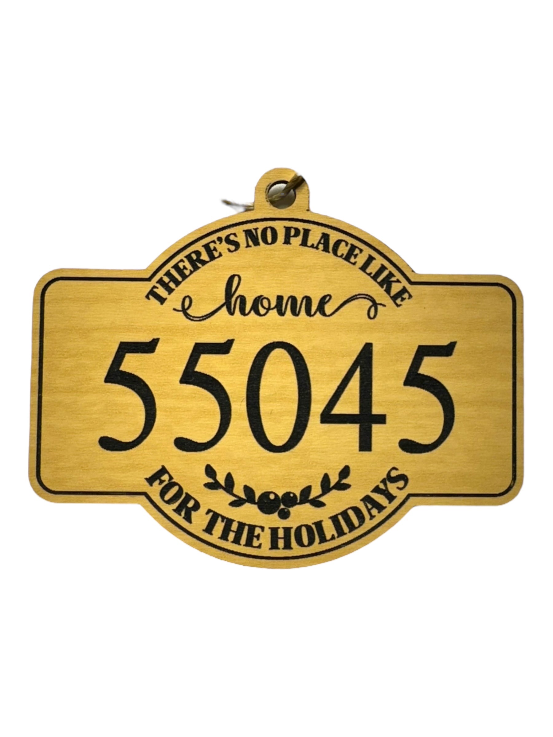 The Ornaments: 55045 No Place Like Home wooden holiday décor displays the phrase Theres no place like home for the holidays with 55045 at its center.