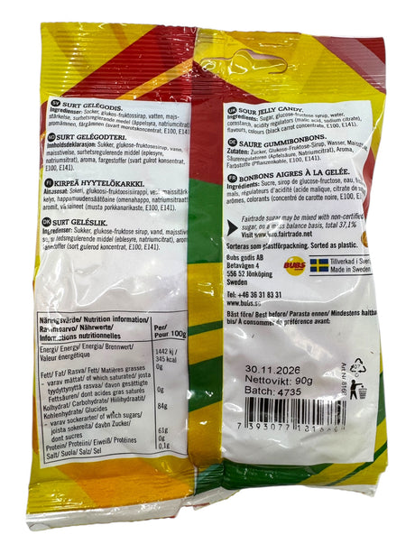 Back view of a Bubs Skalle - Sour Citrus Skulls (90g) package showing Fairtrade sugar, product details, ingredients, nutrition facts, and barcode in several languages.