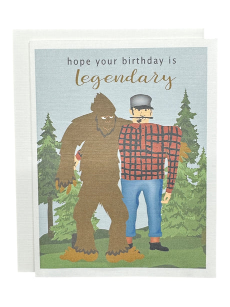 Celebrate with the Hope Your Birthday is Legendary with Bigfoot & Paul Bunyan Birthday Card, featuring Paul Bunyan in plaid alongside Bigfoot and pine trees. A fun greeting card for anyone who loves a tall tale!.