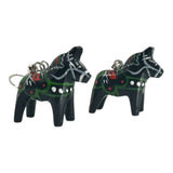 A pair of black Dala Horse earrings, handcrafted in Swedish folk art style, featuring painted green, red, and white decorative patterns. Each earring measures 2cm (0.75) high.