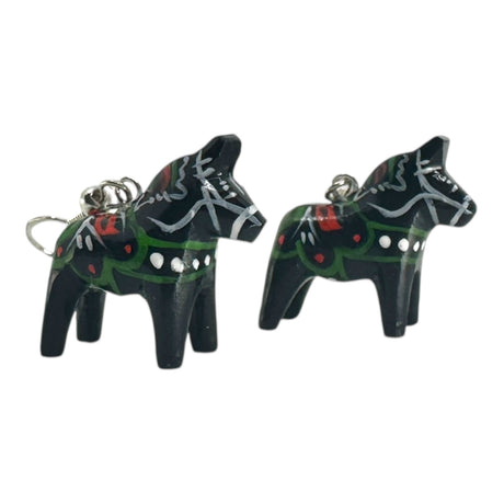 A pair of black Dala Horse earrings, handcrafted in Swedish folk art style, featuring painted green, red, and white decorative patterns. Each earring measures 2cm (0.75) high.