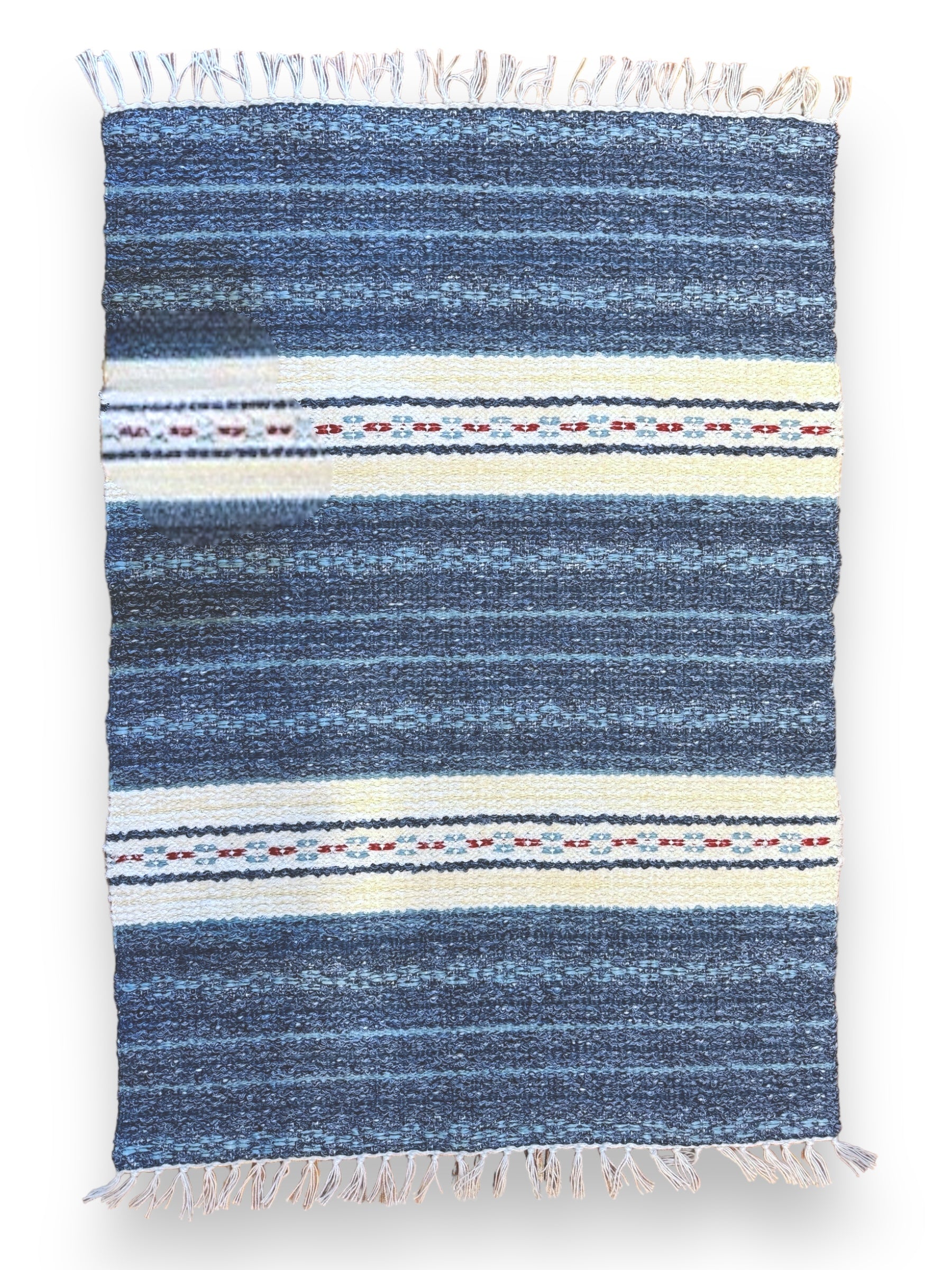 The Rug: Mixed Asta - Blue, crafted from a combination of cotton and vinyl, presents a Swedish design with blue and white stripes accented by vibrant geometric patterns and fringed edges, providing durable long-lasting quality that's perfect for both indoor and outdoor settings.