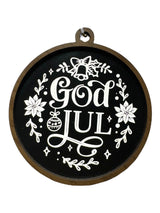 The Ornaments: God Jul Black with White Lettering & Trim brings Swedish Christmas charm to your décor, featuring white text and floral designs—perfect as a festive Merry Christmas ornament.
