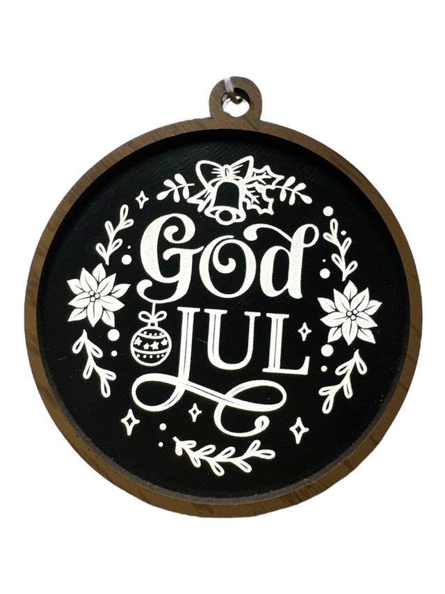 The Ornaments: God Jul Black with White Lettering & Trim brings Swedish Christmas charm to your décor, featuring white text and floral designs—perfect as a festive Merry Christmas ornament.