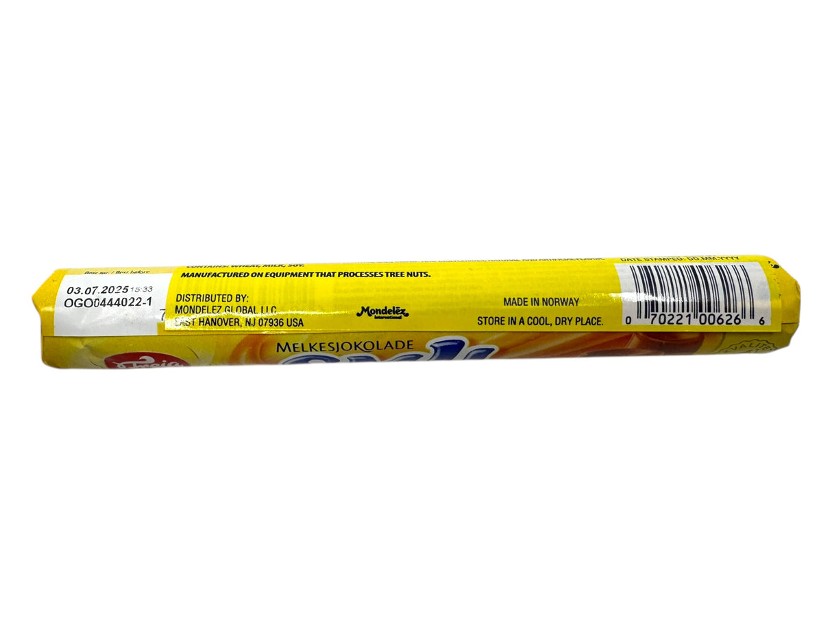 A yellow-wrapped bar labeled Freia Smil Milk Chocolate Caramel Roll (78g) displays distributor and manufacturing info, barcode, and storage instructions.