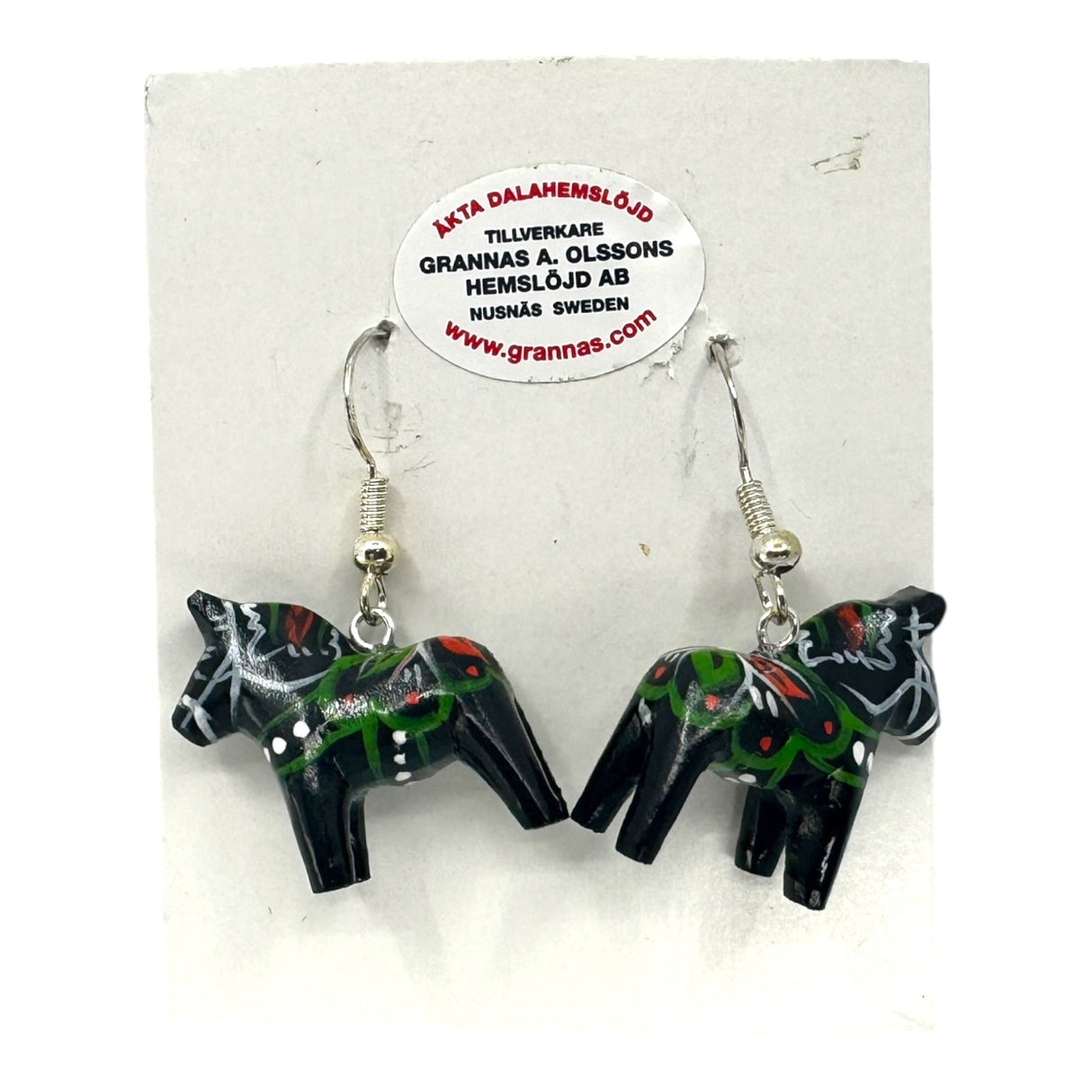 Experience Swedish folk art with these handcrafted 2cm (0.75) black Dala Horse earrings, featuring colorful painted patterns. Presented on a white card, they showcase the artistry of Swedens traditions.
