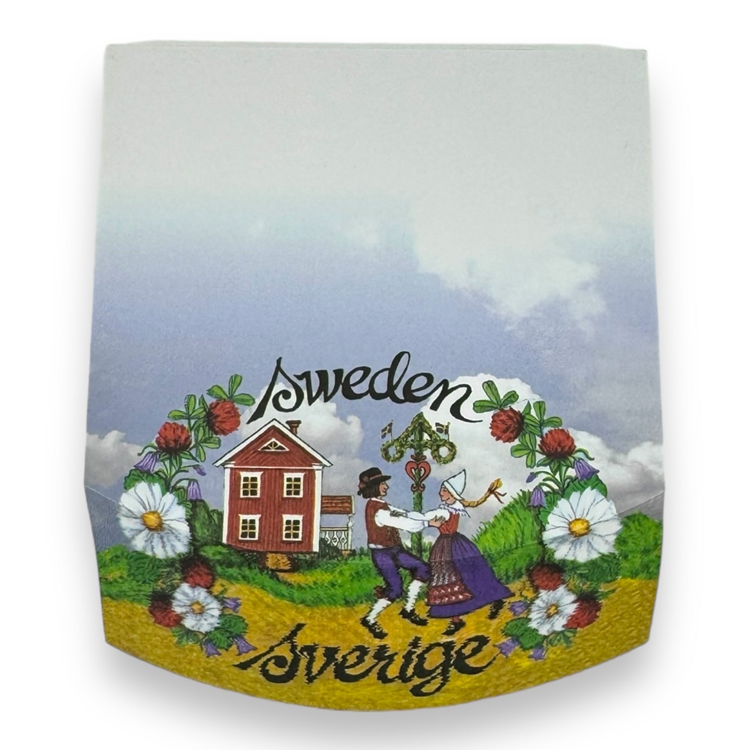 The image on the Tablet: Note Pad Sverige Sweden depicts a couple dressed in traditional Swedish clothing dancing beside a charming red house, enveloped by flowers and a lush summer meadow. The words "Sweden Sverige" are elegantly displayed above and below, accentuated by vibrant Dala horses that infuse additional charm into the scene.