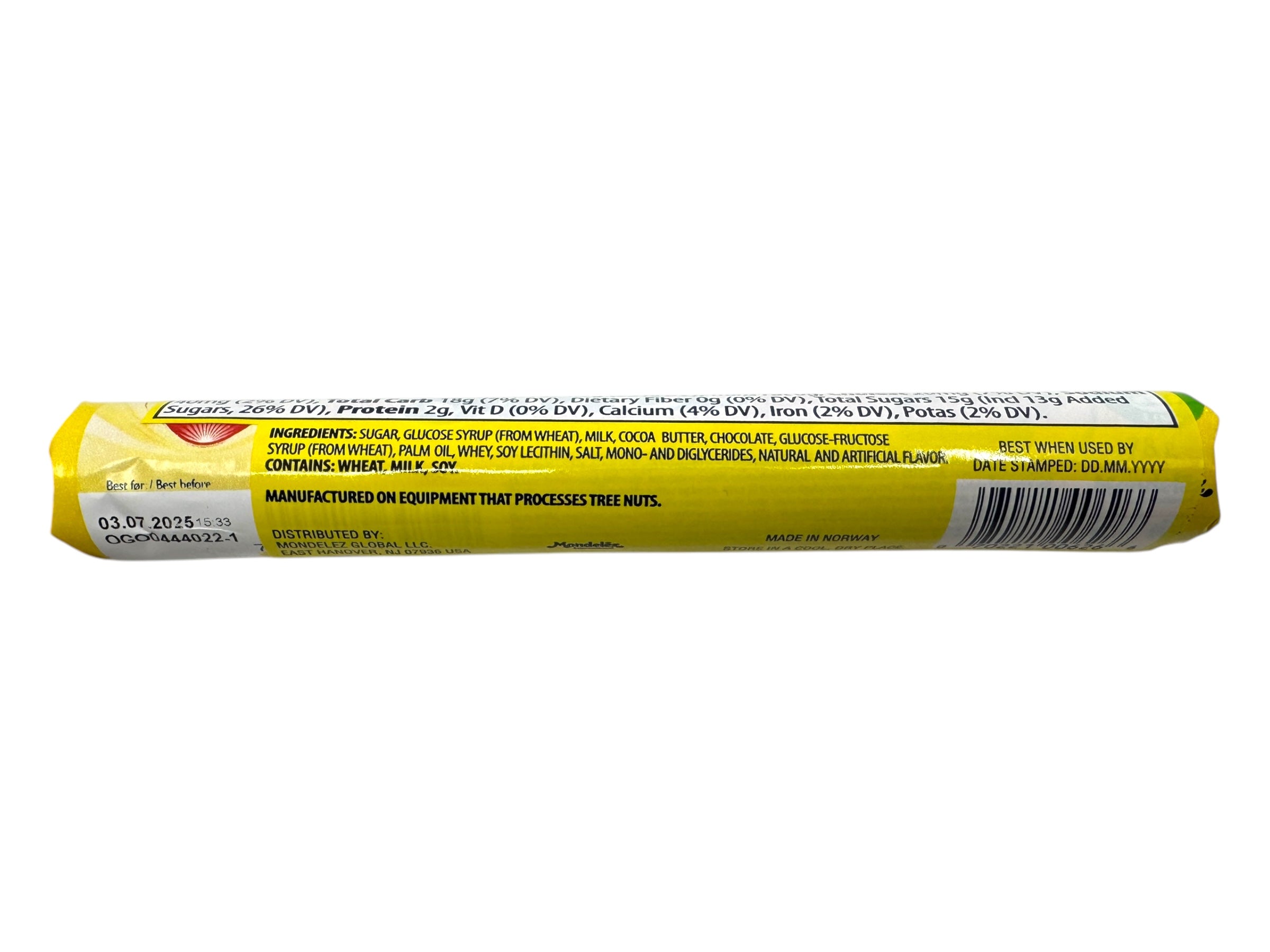 A cylindrical yellow package of Freia Smil Milk Chocolate Caramel Roll (78g) from Norway shows its ingredients, nutrition facts, and manufacturing details on the back.