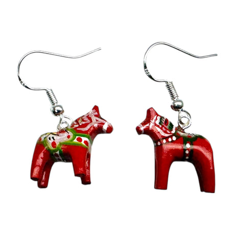 These Dala Horse Red Earrings feature handcrafted 2cm charms inspired by Swedish folk art, with painted red horse designs.