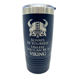 The 20 oz Stainless Steel Polar Camel Tumbler features a Viking helmet graphic and the phrase “Always be yourself unless you can be a Viking,” with double-wall insulation and a slide shut lid to keep drinks hot or cold longer.