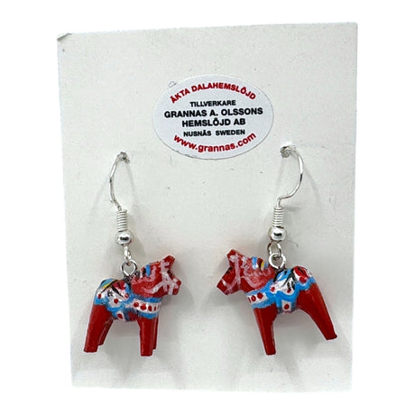 A pair of Earrings: Dala Horse Red Earrings – Handcrafted Swedish Folk Art (2cm / 0.75 high), featuring colorful painted details, displayed on a white card with manufacturer information.
