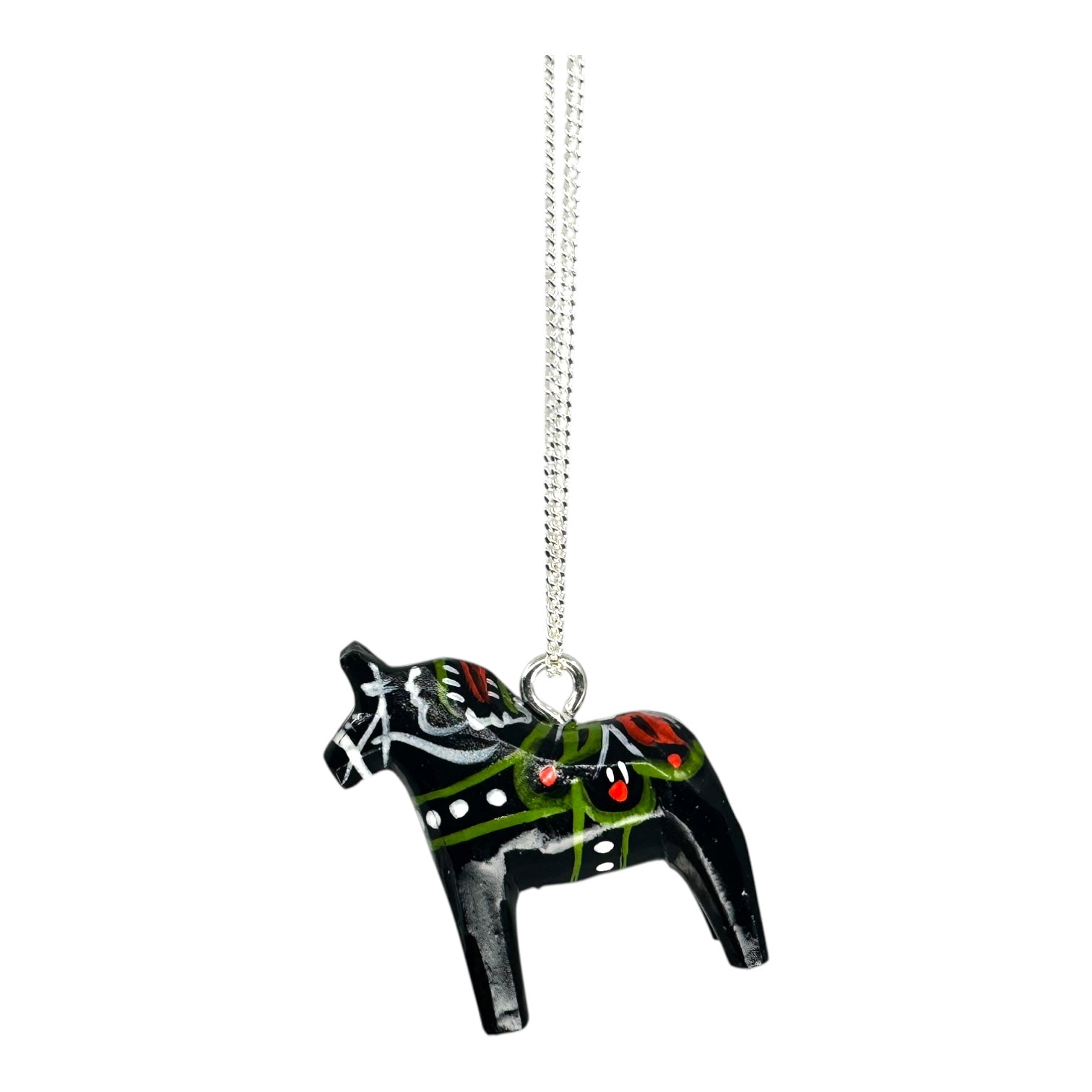 The Necklace: Black Dala Horse Necklace – Handcrafted Pendant features a black wooden Dala horse with red, green, white, and yellow painted details on a silver chain, highlighting Swedish craftsmanship against a white background.