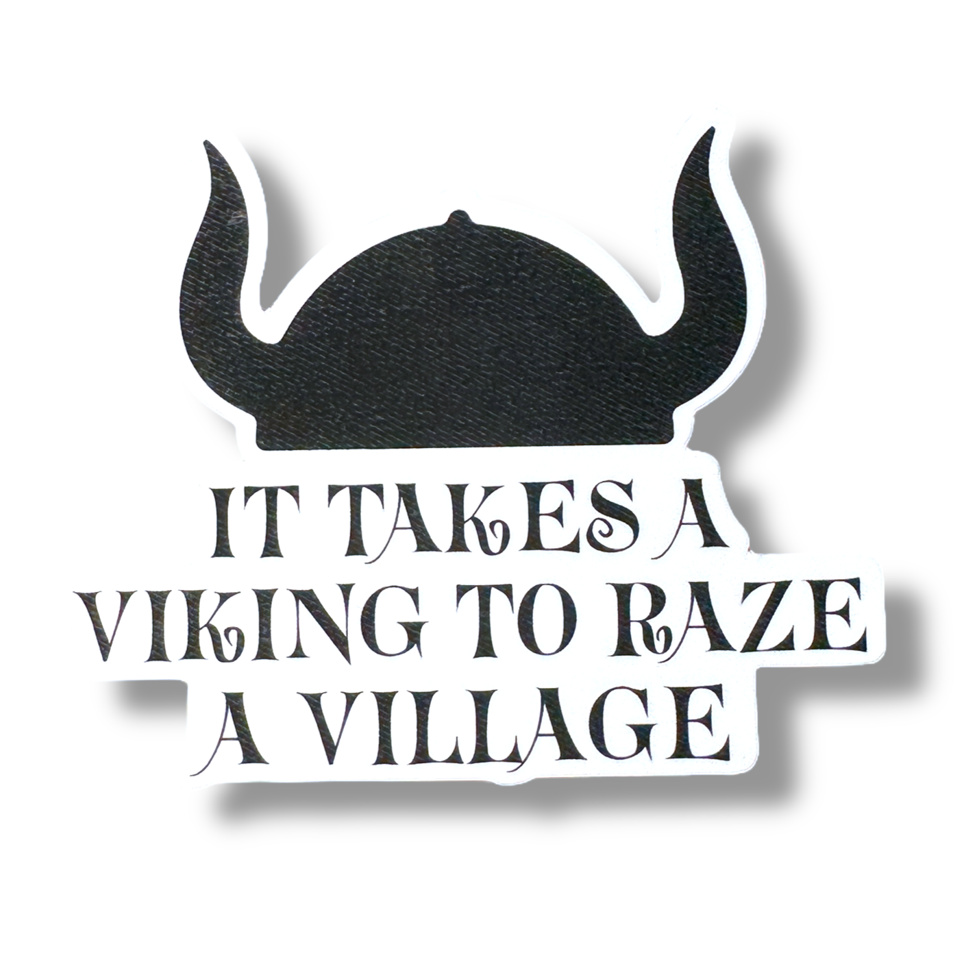 The sticker features a black silhouette of a Viking helmet above the text It Takes A Viking to Raze A Village on a white background, ideal for your collection.