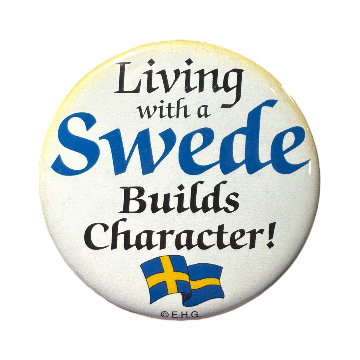 Adorned with two small Swedish flags, the Living with a Swede Builds Character! refrigerator magnet is perfect for those proud of their roots or looking to add a quirky Nordic touch.