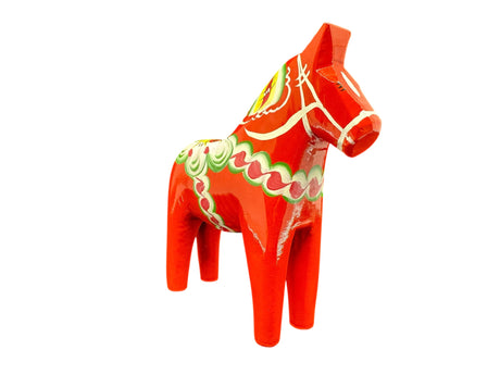 The Dala Horse: Red 6" Swedish Dala Horse Figurine is handcrafted in Sweden and features classic colorful patterns, embodying traditional Nordic folk art.
