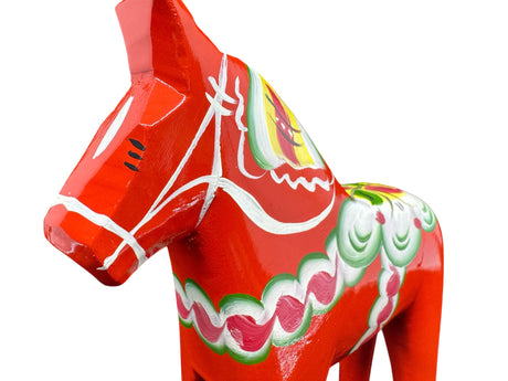 The 6" Red Swedish Dala Horse Figurine is handcrafted in Sweden, featuring Nordic folk art with painted white, green, and pink patterns, and is shown against a plain white background.