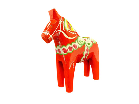 The Dala Horse: Red 6" Swedish Dala Horse Figurine is a handcrafted piece from Sweden, featuring traditional painted green, yellow, and white patterns—a charming example of Nordic folk art.