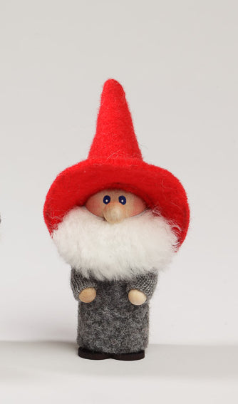 The Sven Swedish Santa figurine, handcrafted, features a red pointed hat, white beard, and gray attire against a plain background.