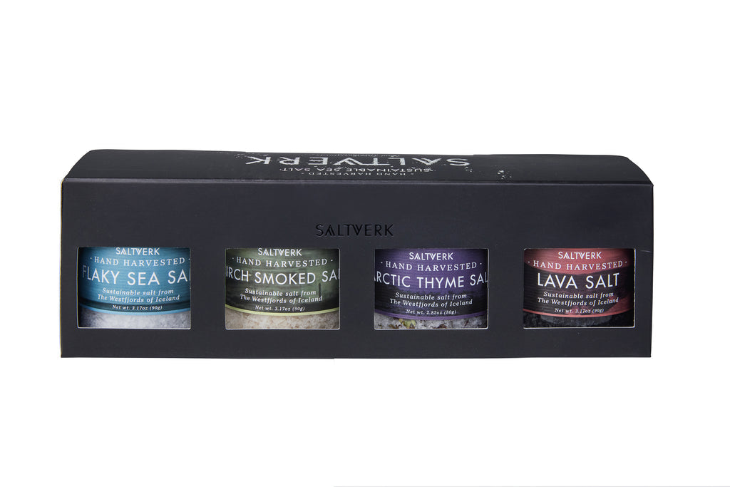 Saltverk 4-Flavor Gift Box features four Icelandic sea salts: Flaky Sea Salt, Lava Salt, Birch Smoked Salt, and Arctic Thyme Salt—each in its own jar.