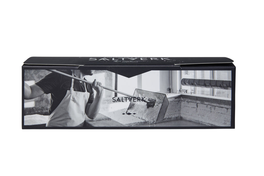 A rectangular Saltverk 4-Flavor Gift Box (Flaky Sea Salt, Lava Salt, Birch Smoked, Arctic Thyme) features a black-and-white photo of a person raking Icelandic sea salt at a saltworks.