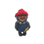A ceramic Nisse wife figurine, donned in a red knit hat and blue dress, holding a rolling pin, stands on a white background—ideal for enhancing Scandinavian decor.