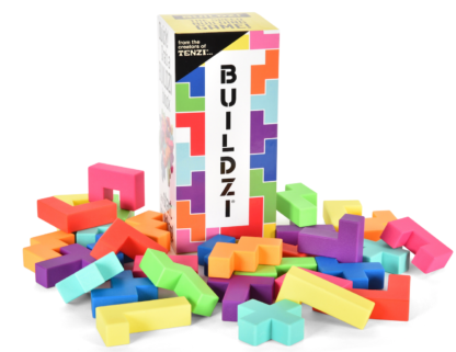 A box labeled Game: BUILDZI Blocks for up to 4 Players stands upright, surrounded by colorful interlocking BUILDZI blocks—ideal for a fun and competitive block-building game.