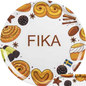 The Round Fika Tray, 38cm, showcases FIKA at its center with charming illustrations of Swedish pastries, a flag, and spices like cinnamon and star anise. Its handcrafted wood design adds Scandinavian charm, making it a perfect centerpiece for cozy gatherings.