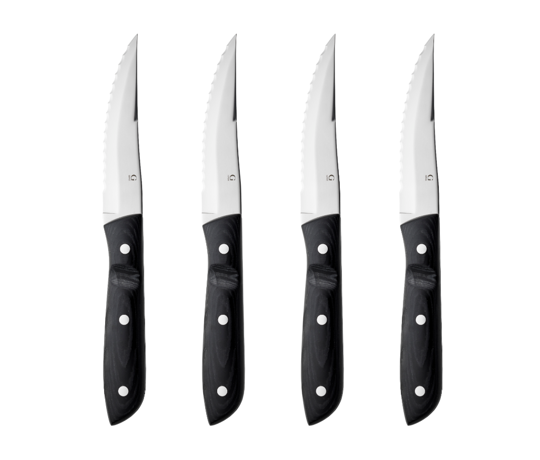 The Gense: Old Farmer Micarta Steak Knife set features four sleek knives with black handles and serrated edges, crafted from durable stainless steel and conveniently dishwasher safe.