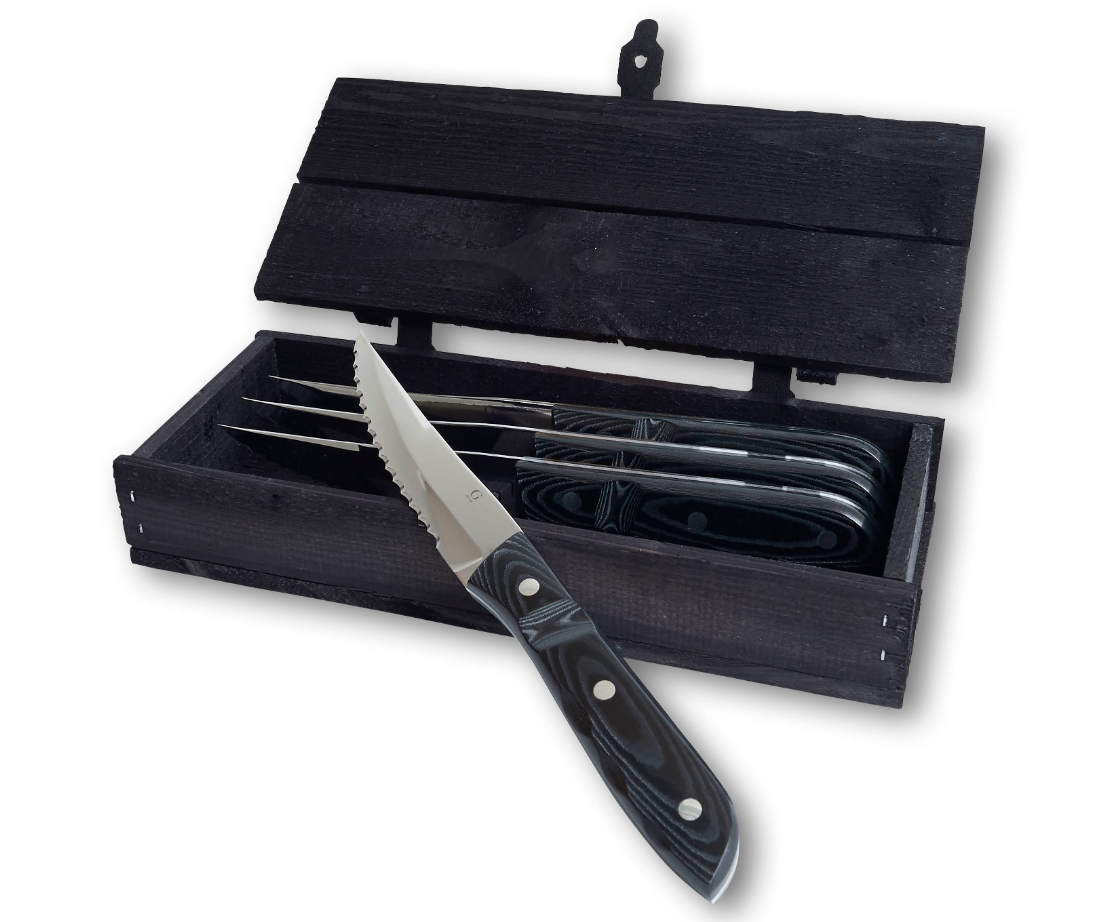 A Gense: Old Farmer Micarta Steak Knife in serrated stainless steel with a black handle, showcased in an open black wooden box, featuring one dishwasher-safe knife prominently displayed.