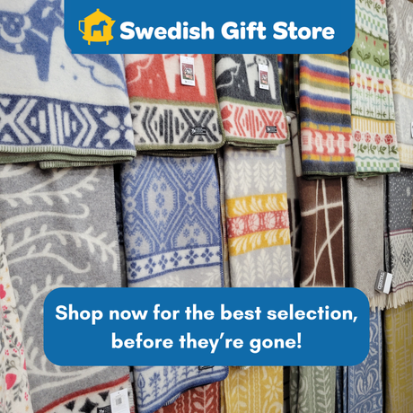 Discover the Black Dala Horse Pattern Dalarna Wool Blanket (130 × 180 cm, 100% Norwegian lambswool) displayed in rows—shop now at Swedish Gift Store for the best selection before they’re gone!.