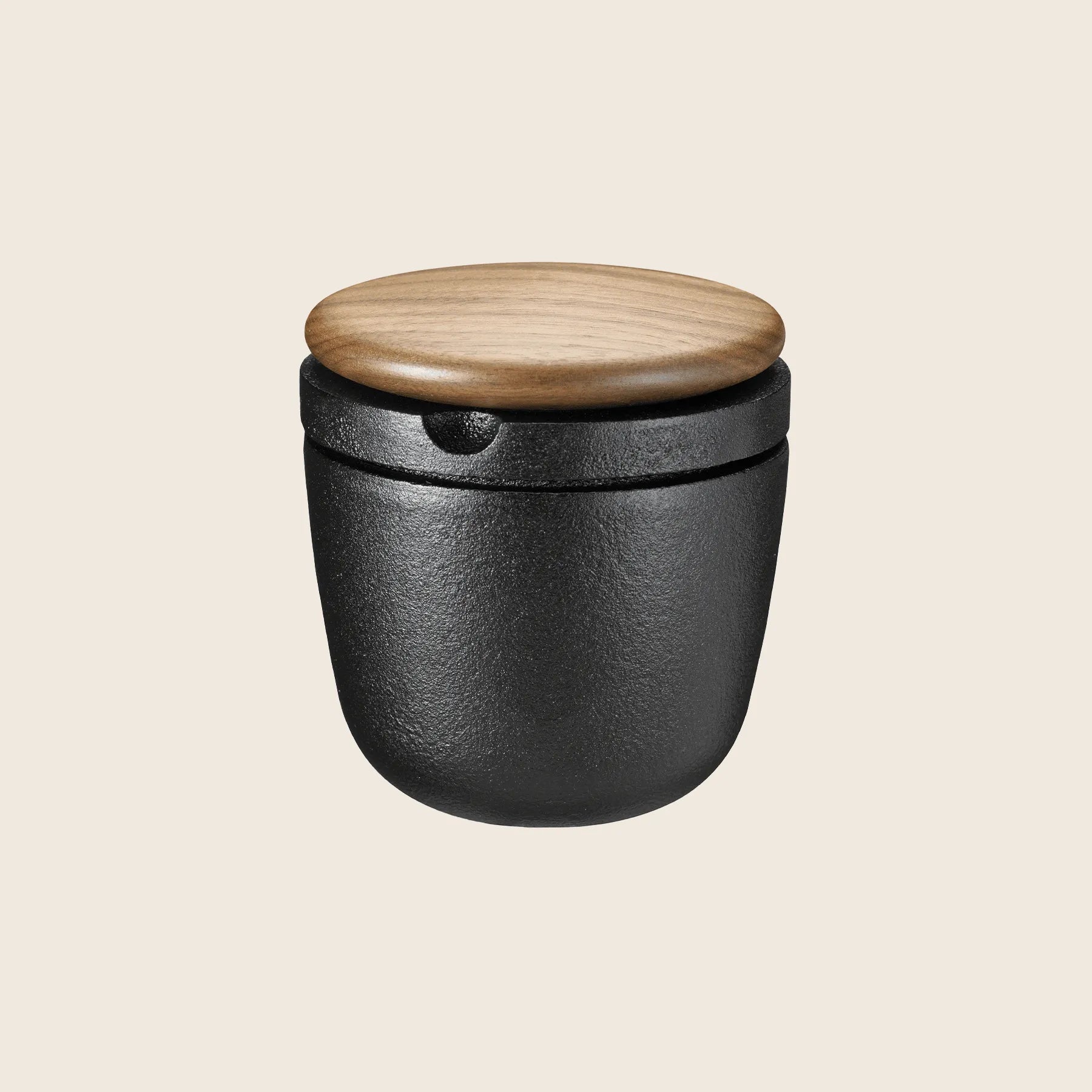 Skeppshult Swing Spice Mill in black ceramic with a walnut lid displayed on a light background.