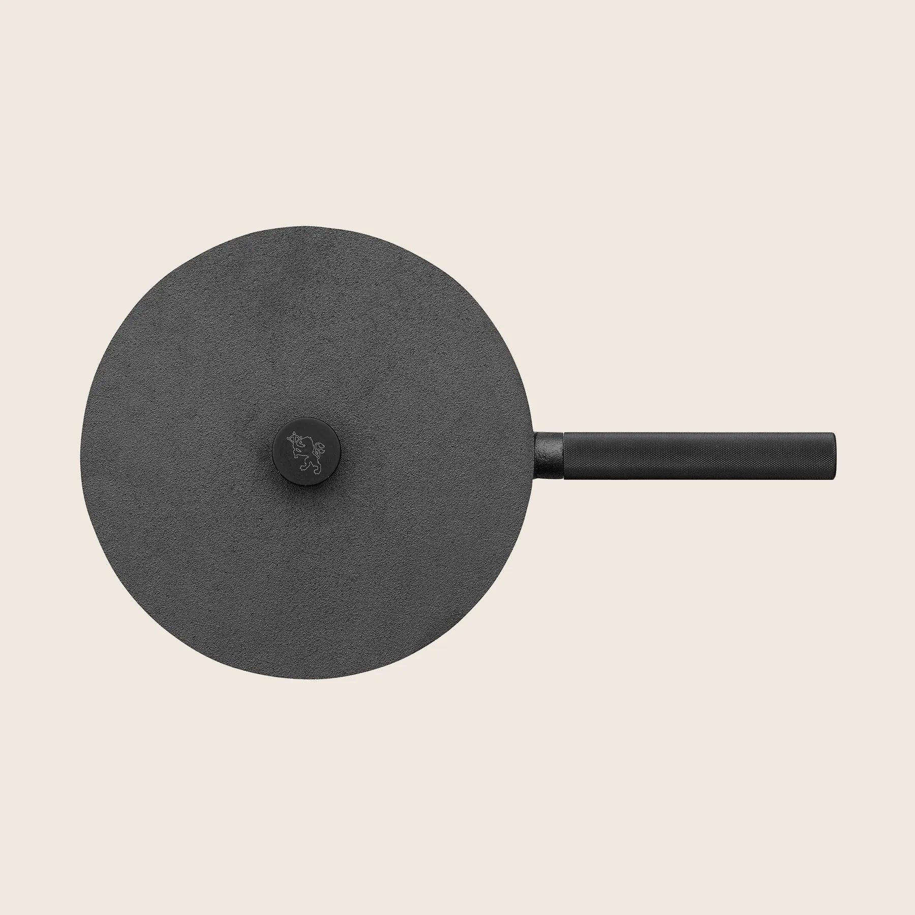 Top view of a black Skeppshult Deep Skillet (11/28 cm) with a circular lid and handle, featuring its smooth non-stick surface on a light beige background.