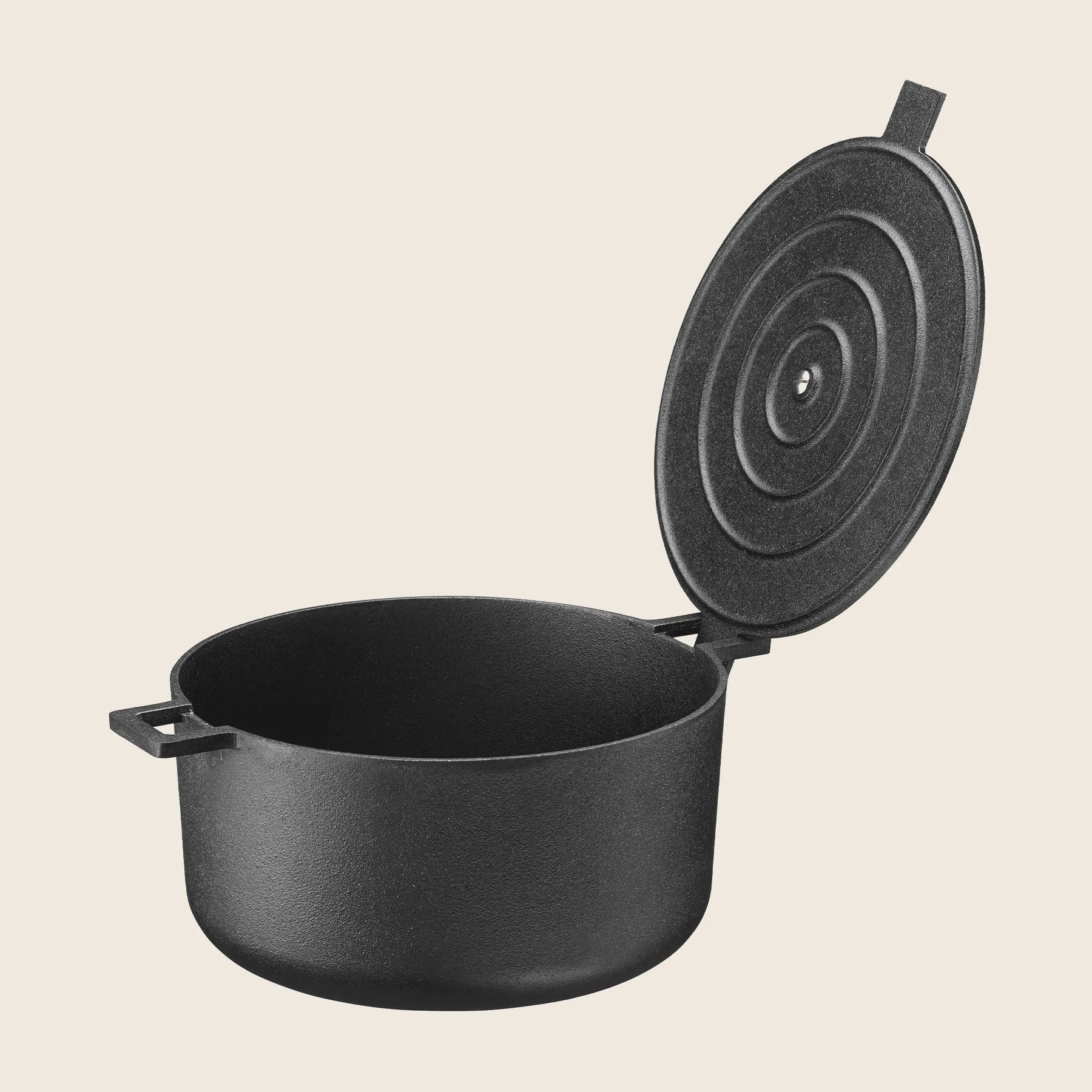 The Skeppshult Dutch Oven with Cast Iron Lid, 5.25 qt/5 L, is black and seasoned with organic canola oil. It features a textured surface, side handles, and promises durability and excellent heat retention for cooking needs. Displayed on a neutral background, its a culinary classic.