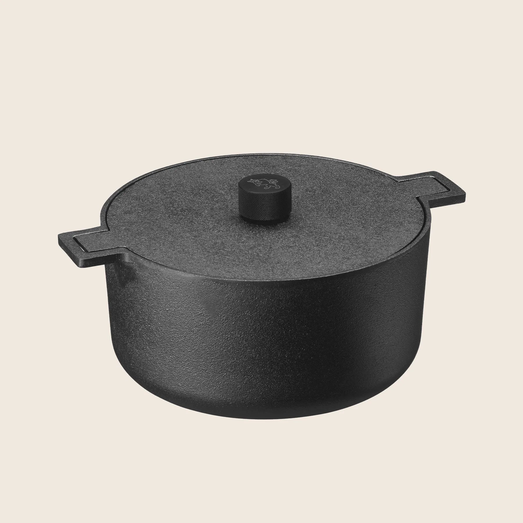 The Skeppshult Dutch Oven, 5.25 qt black cast iron with a lid and side handles, set against a light background, combines style and function for your culinary creations.