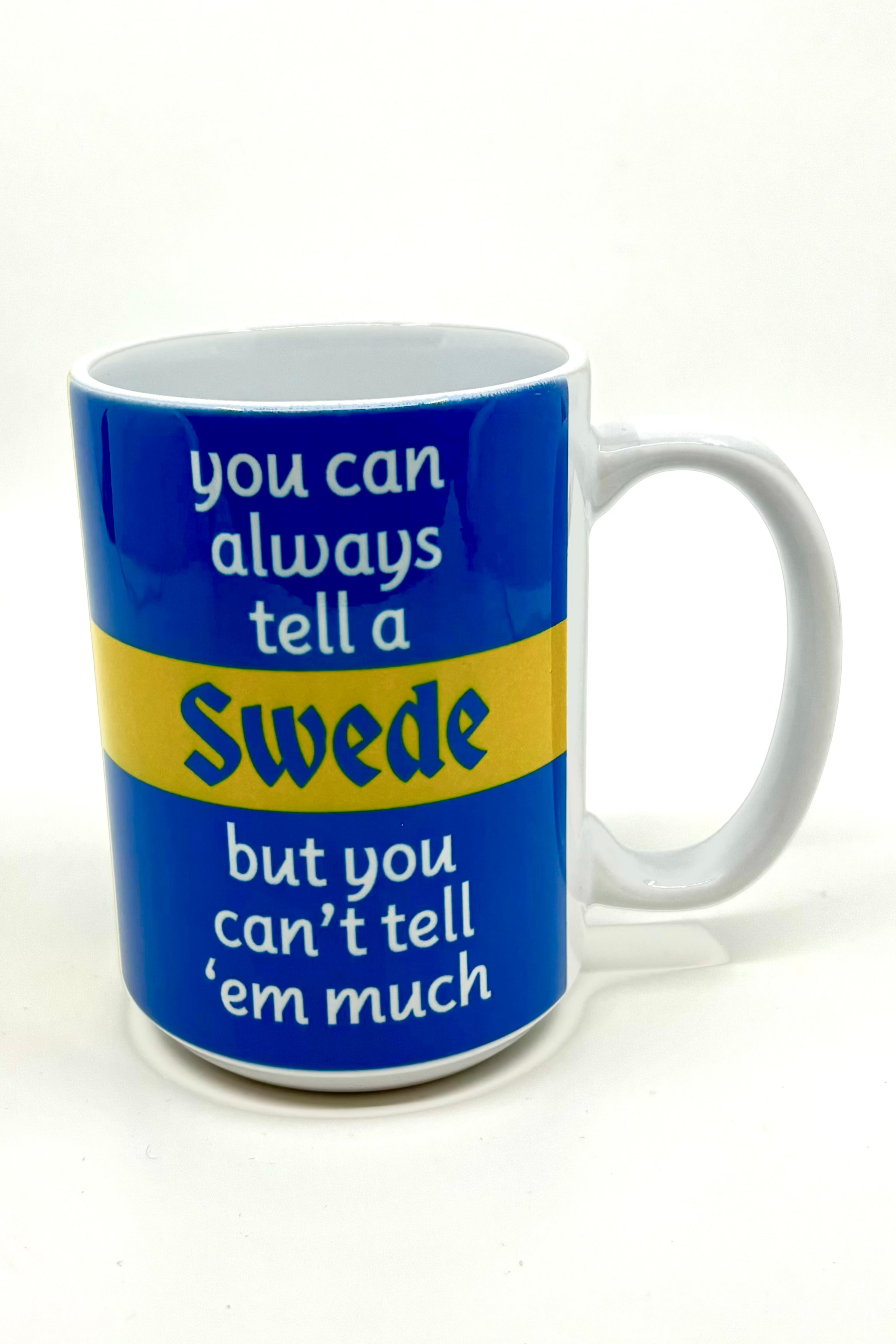 A 15 oz Swede mug in blue and yellow featuring the text: "You Can Tell a Swede, but you can't tell 'em much.