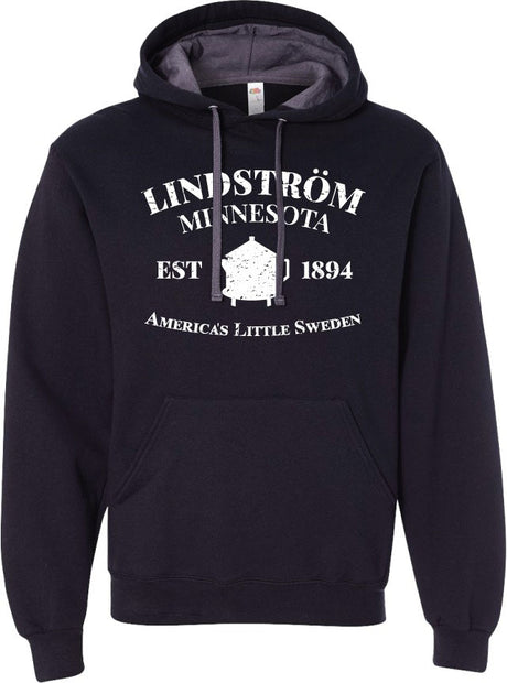 The Hoodie: Lindström Minnesota EST 1894 Hoodie – Black (Unisex) features white text that reads "Lindström Minnesota Est 1894 America’s Little Sweden" and a small house graphic.