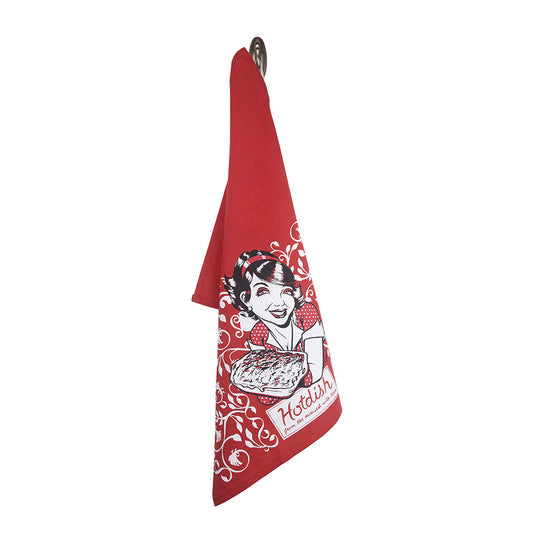 The Tea Towel: Hotdish, crafted in the USA from high-quality printed cotton, features a red design that is machine washable and displays a vintage-style illustration of a woman holding a pie surrounded by decorative white swirls.