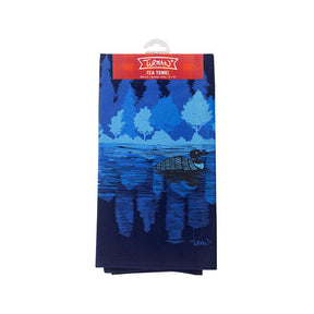 The Tea Towel: Midnight Loon features Adam Turman's artistic touch with a captivating blue turtle design gracefully swimming under trees. Paired with a striking red label, it beautifully captures the enchanting spirit of Minnesota Midnight.