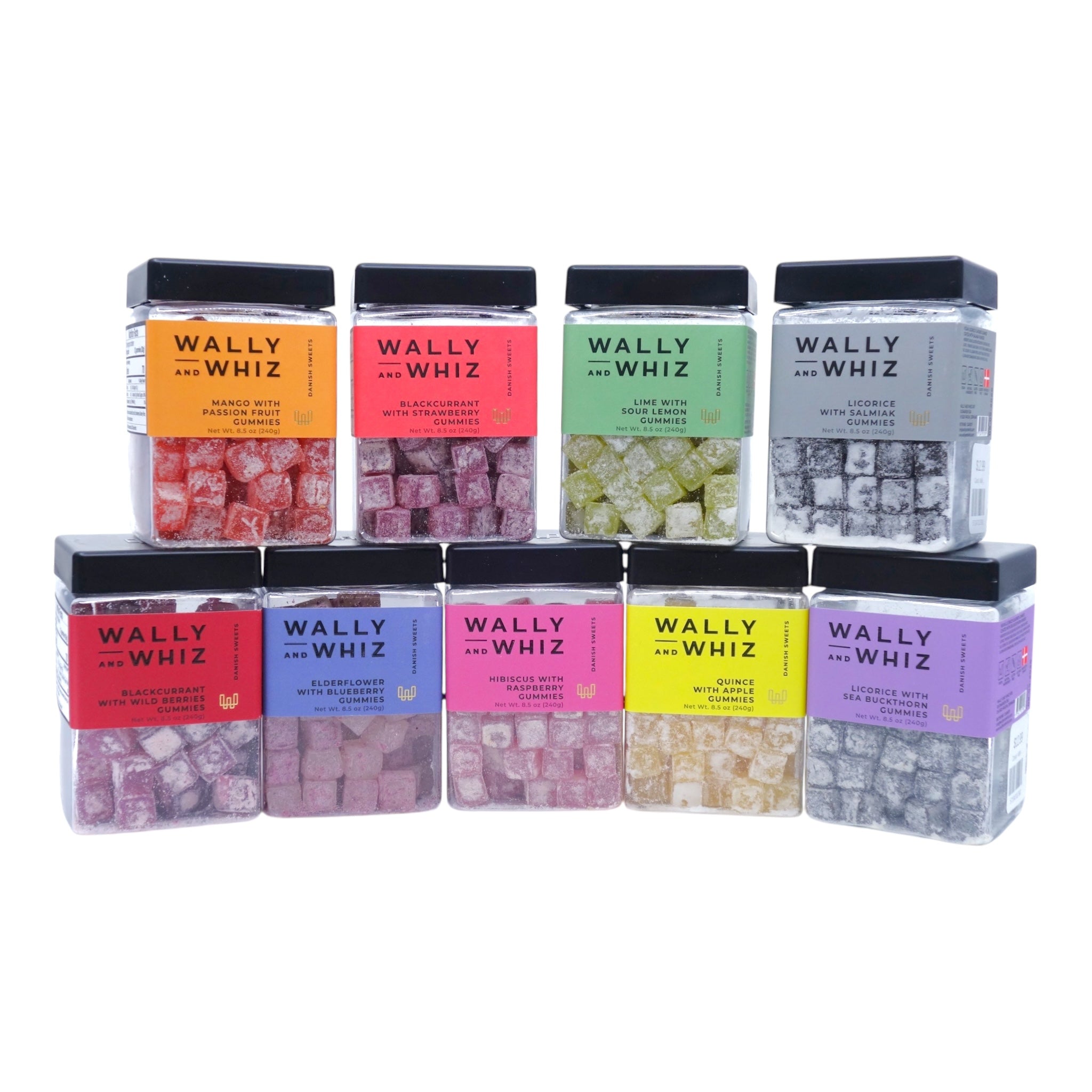 Nine clear jars of Wally & Whiz Danish Winegum Candy Gummies in assorted flavors are arranged in two rows on a white background, showcasing a vibrant variety of gluten-free treats.