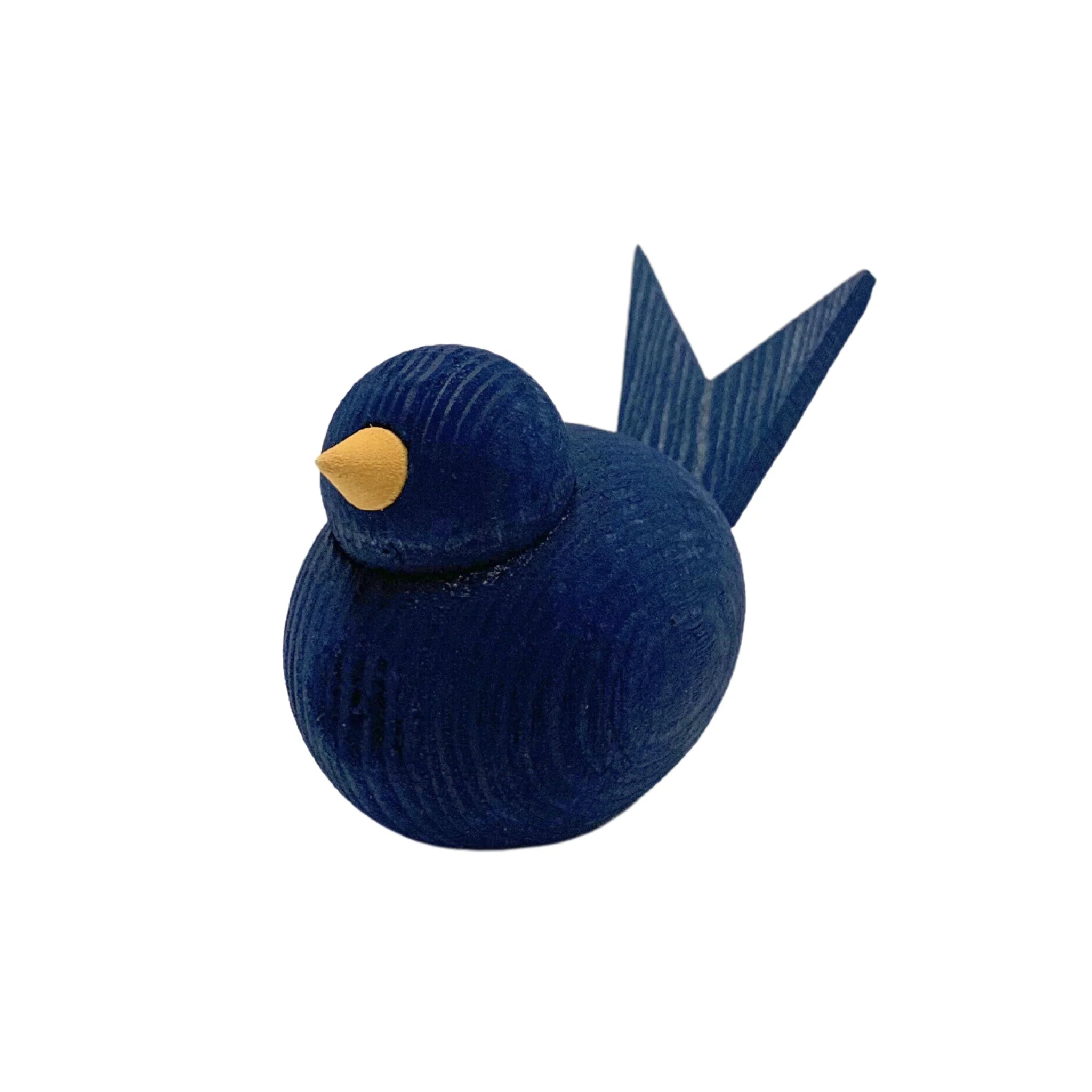 This dark blue wooden bird figurine, part of the Swedish Handcrafted Wooden Birds series in red, white, and blue, features a yellow beak and pointed tail, capturing the charm of traditional Swedish craftsmanship.