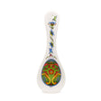 A green Norwegian rosemaling ceramic spoon rest with colorful floral patterns—perfect for adding Scandinavian charm to your kitchen decor.