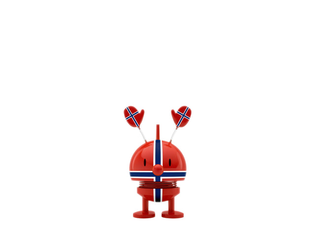 Red Hoptimist desk toy featuring Norway flag patterns and heart-shaped antennae on top, displayed against a plain white background.