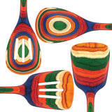 The Marrakesh Mixing Wooden Spoon, crafted from birch, showcases multicolored layers in orange, green, blue, and natural wood tones against a white background.